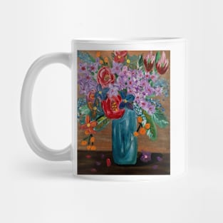 Some mixed vibrant flowers in a glass vase . Mug